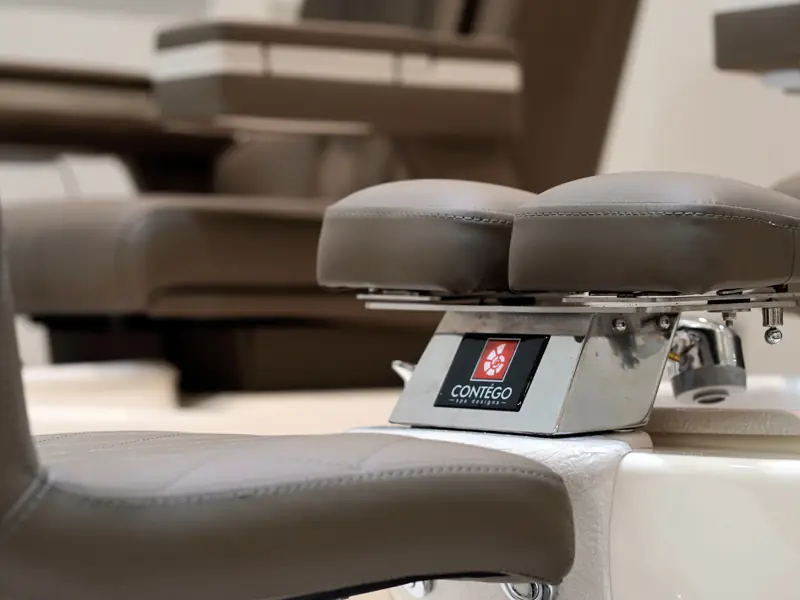 A close look at a pedicure chair's footrest and controls