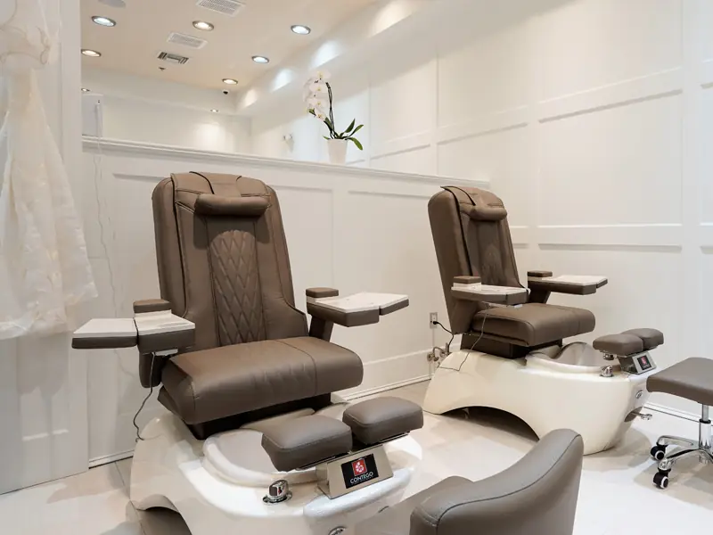 Two espresso pedicure thrones with white spa basins at Tipsy Nails & Spa