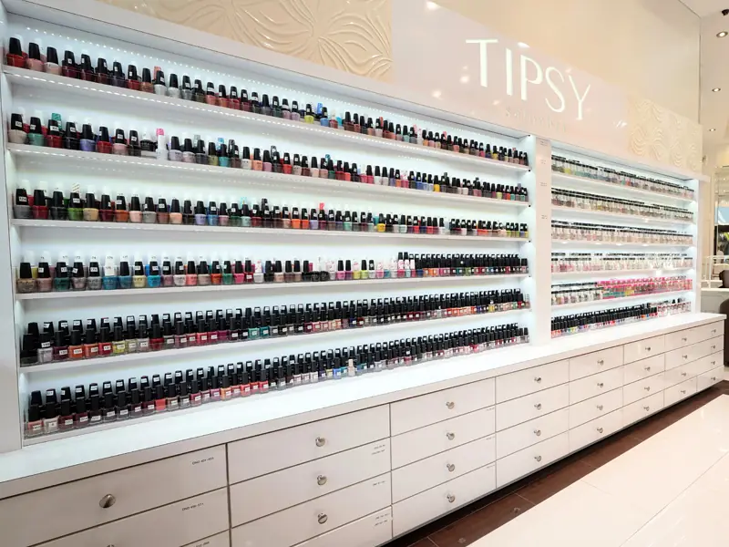 The polish wall from the side, drawers of color stretching down the salon
