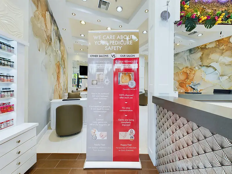 Reception, with our pedicure safety banner and the floral wall