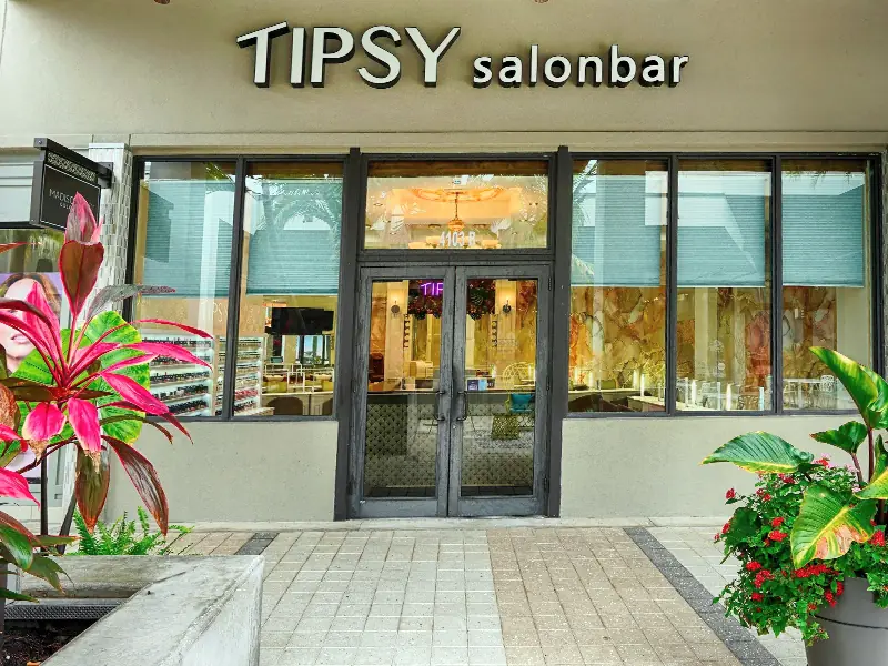 The Tipsy Salonbar storefront at Downtown at the Gardens, with its black TIPSY signage